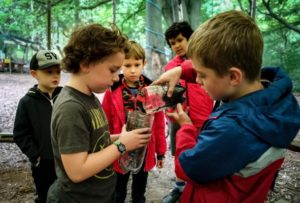 TRIBE Bushcraft adventure day session filling the water filter with water from the stream