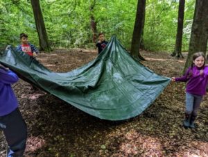 TRIBE Bushcraft child adventure day session moving a tarp