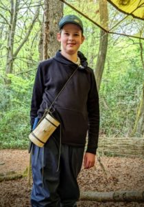TRIBE Bushcraft home school education session child showing the completed split wood cup 2