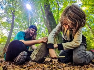 TRIBE Bushcraft home school education session children setting up the figure 4 trap