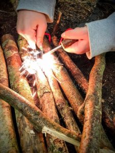 TRIBE Bushcraft home school education session making a fire using the ferrorod