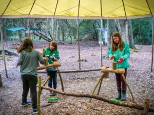 TRIBE Bushcraft home school education session split log cup being made