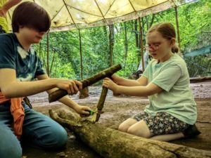 TRIBE Bushcraft home school education session using a stick to baton wood