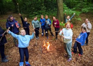 TRIBE Bushcraft school group booking children enjoying marshmallows