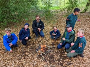TRIBE Bushcraft scout group learning how to build a fire