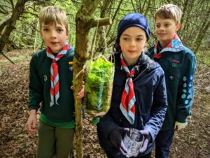 TRIBE Bushcraft scout group water filter being hung in a tree 3