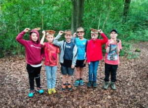 TRIBE Bushcraft session adventure day children showing their completed willow fish