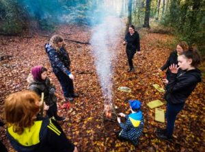 TRIBE Bushcraft session birthday party toasting marshmallows on the fire