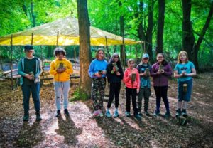 TRIBE Bushcraft session discovery day children showing their completed bushcraft cups