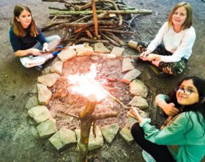 TRIBE Bushcraft session discovery day cooking bread twists on the fire