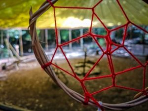 TRIBE Bushcraft session dream catcher hung up in main camp