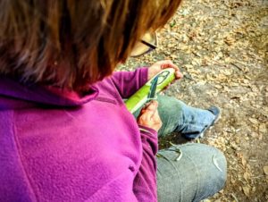 TRIBE Bushcraft session social saturdays family bushcraft adult carving a spoon from a hazel blank of wood