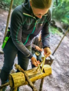 TRIBE Bushcraft session social saturdays family bushcraft adult constructing the figure 4 trap