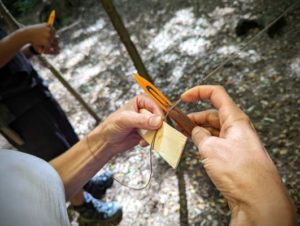 TRIBE Bushcraft session social saturdays family bushcraft adult using the netting needle and gauge 2