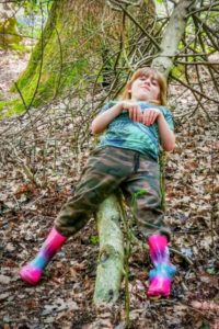 TRIBE Bushcraft session social saturdays family bushcraft child having fun on a log