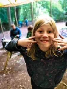 TRIBE Bushcraft session social saturdays family bushcraft child having fun with dirt at TRIBE main camp