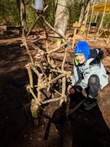 TRIBE Bushcraft session social saturdays family bushcraft child showing completed stick tower