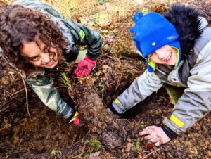 TRIBE Bushcraft session social saturdays family bushcraft children handshake under ground making a Dakota fire