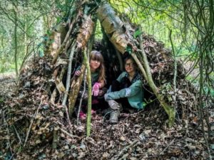 TRIBE Bushcraft session social saturdays family bushcraft children inside a mini teepee