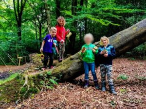 TRIBE Bushcraft session social saturdays family bushcraft children showing the bushcraft cups they made