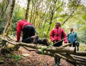 TRIBE Bushcraft session social saturdays family bushcraft children testing out the stick hammock 7