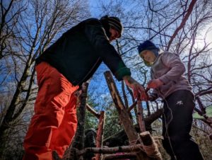 TRIBE Bushcraft session social saturdays family bushcraft constructing a stick tower 2