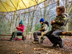 TRIBE Bushcraft session social saturdays family bushcraft knives being used to carve green wood