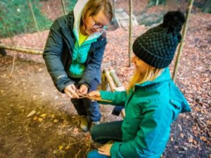 TRIBE Bushcraft session social saturdays family bushcraft making a willow fish being demonstrated