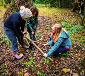 TRIBE Bushcraft session social saturdays family bushcraft processing hazel to make a bridge