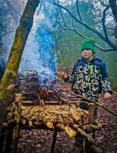 TRIBE Bushcraft session social saturdays family bushcraft raised fire being used 1