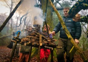 TRIBE Bushcraft session social saturdays family bushcraft raised fire being used 3