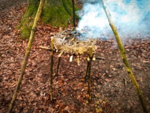 TRIBE Bushcraft session social saturdays family bushcraft raised fire being used 4