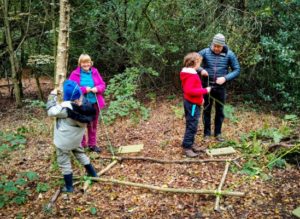 TRIBE Bushcraft session social saturdays family bushcraft tying sticks together to make a stick hammock 2