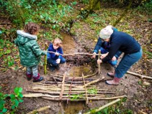 TRIBE Bushcraft session social saturdays family bushcraft tying the handrail for the bridge 1